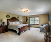 Hillside home with mountain view, wrap-around deck & great family room