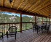 Hillside home with mountain view, wrap-around deck & great family room