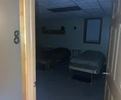 A room with 5 single beds