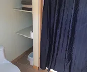 Room w/ a double bed and twin over twin bunk beds