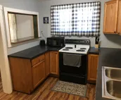 Cozy two bedroom cottage on 2 fenced in acres.