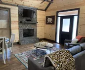 Standing Bear Studio Cabin with Hot Tub on the Deck by RedAwning
