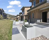 Modern home with three balconies, mountain views, and outdoor swimming pool. ...