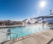Modern home with three balconies, mountain views, and outdoor swimming pool. ...