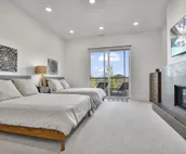Modern home with three balconies, mountain views, and outdoor swimming pool. ...