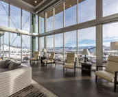 Modern home with three balconies, mountain views, and outdoor swimming pool. ...