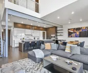 Modern home with three balconies, mountain views, and outdoor swimming pool. ...