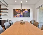 Modern home with three balconies, mountain views, and outdoor swimming pool. ...