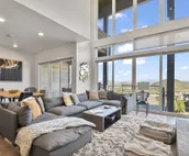 Modern home with three balconies, mountain views, and outdoor swimming pool. ...