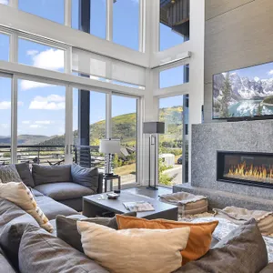 Modern home with three balconies, mountain views, and outdoor swimming pool. ...